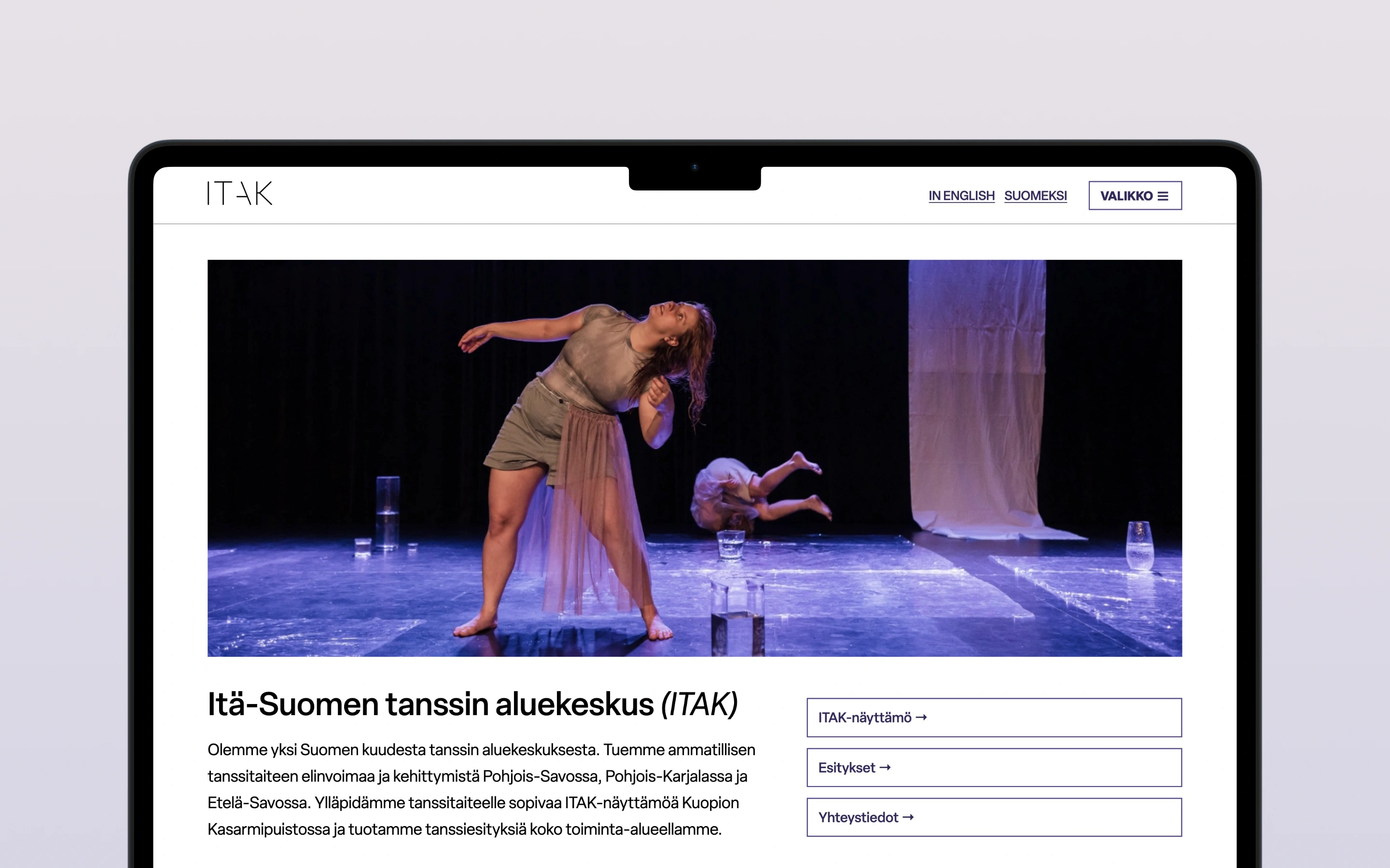 A laptop with the ITAK website on the screen
